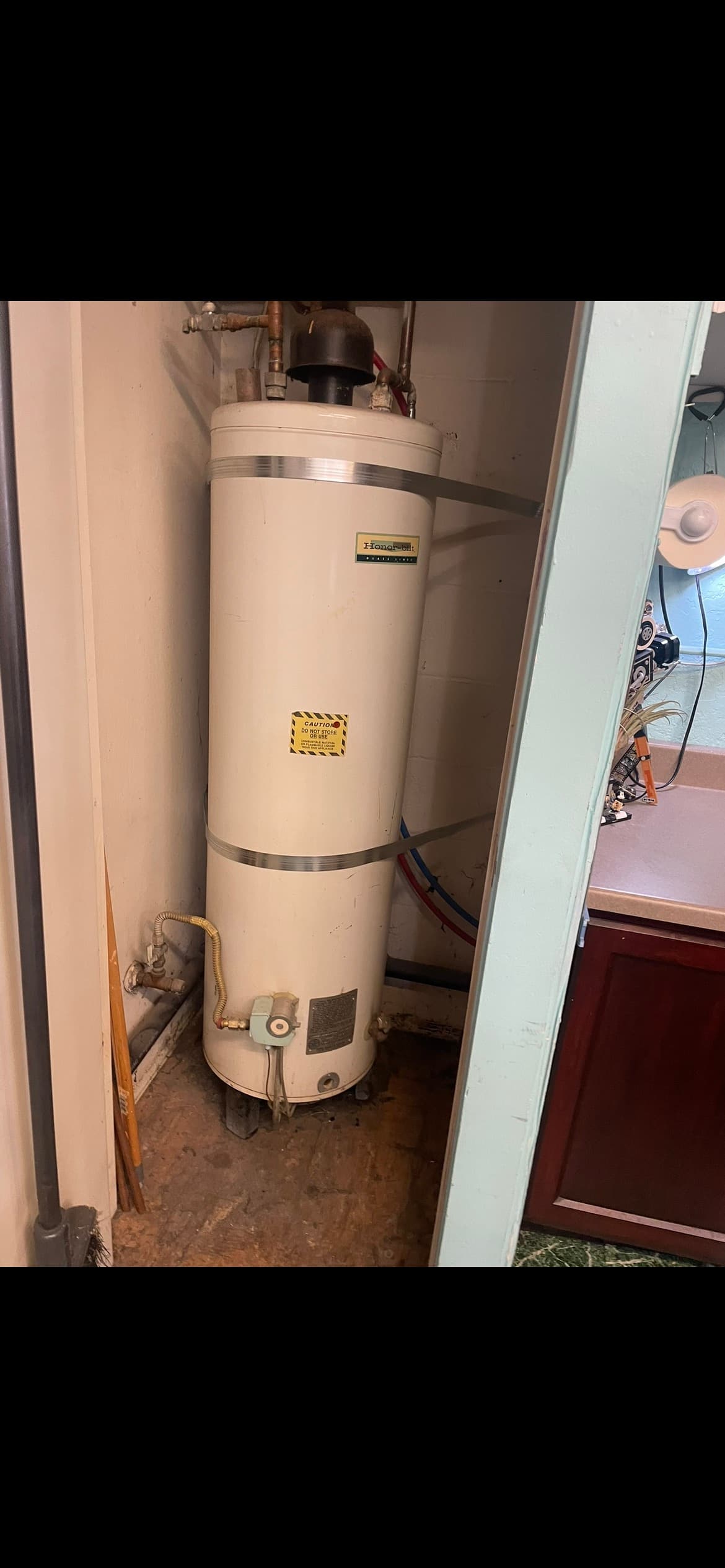 Tank-style water heater installed in a home closet in Santa Rosa